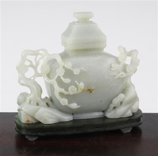 A Chinese pale celadon jade vase and cover, with spinach green jade stand, Qing dynasty or later, 4.3cm., width 13.5cm., fitted rosewoo